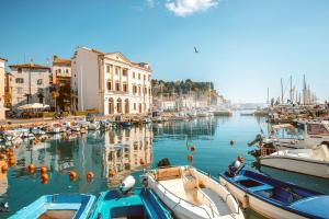 a group of boats are docked in a harbor at Lucy Apartment Piran-Punta in Piran