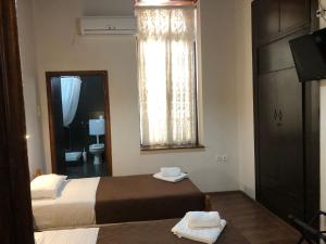Postel nebo postele na pokoji v ubytování Rethymno House
