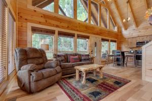 a living room with a couch and a table at Simply Unforgettable in Gatlinburg