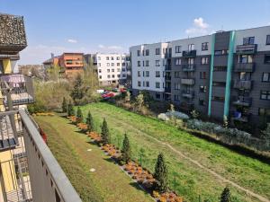 a view from a balcony of a garden with pumpkins at Tesorio Apartment - AC, Free Parking, WiFi, Business & Family in Wrocław