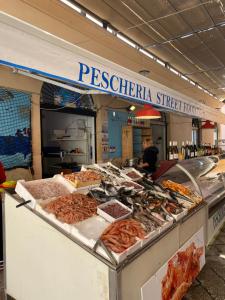 a seafood stand with meat on display in a market at TERRA MIA in Marsala