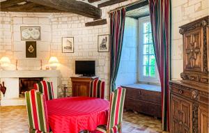 a room with a table and chairs and a window at Nice Home In Chinon With 2 Bedrooms And Wifi in Chinon