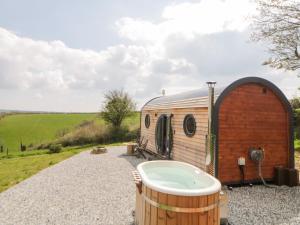 a large bath tub in front of a caravan at Yealm in Plymouth