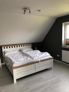 Postel nebo postele na pokoji v ubytování Haus Deichterrasse