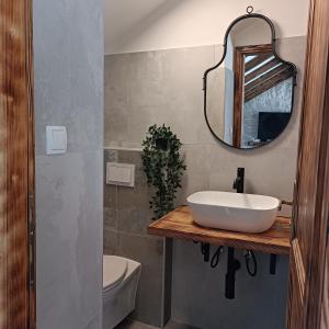 a bathroom with a sink and a mirror at Blue of the sea in Krapanj