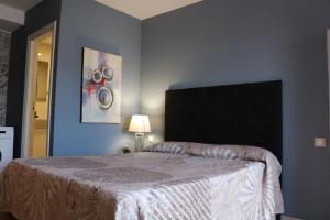 Postel nebo postele na pokoji v ubytování Apartamentos La Carmen