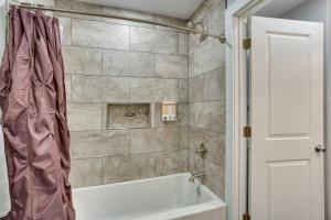 a bathroom with a tub and a shower curtain at Quiet Mount Vernon Escape Fish, Hike and Unwind! in Mount Vernon +18 photos
