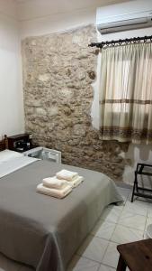 Postel nebo postele na pokoji v ubytování Rethymno House