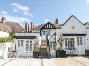 a house with a staircase leading to the front door at Crystal Cove in Bridlington