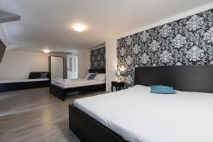 a hotel room with a bed and a mirror at Top Wenceslas Square Apartment in Prague