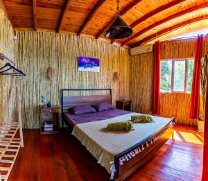 a bedroom with a bed and a wooden ceiling at Olabilir Houses in Ortaca