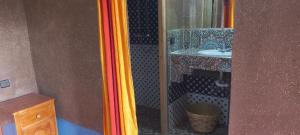 a bathroom with a sink and a mirror at Auberge Amazigh in Tamtetoucht