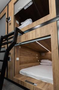 a bunk bed in a room at Capsule hostel Andel Centre SPIRIT in Prague