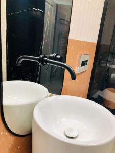 a bathroom with a white toilet and a sink at Joy City Stay Victoriei 7G-13 in Timişoara