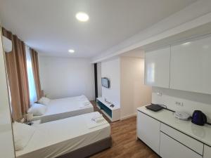 Postel nebo postele na pokoji v ubytování Apartman Casa