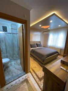 a bedroom with a bed and a shower and a bathroom at Super value in Istanbul