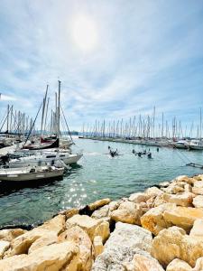 a group of boats in a harbor with people in boats at Emme Apartment IUN (Q8410) in Cagliari