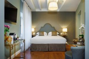 Tempat tidur dalam kamar di Maison Santa Croce