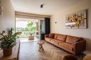 Posezení v ubytování PUUR! Appartementen Curaçao + 37 fotografií