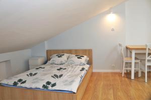 Ένα ή περισσότερα κρεβάτια σε δωμάτιο στο Apartamenty Listopadowe