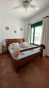 a large bed in a room with a window at Brisa Marinera in El Rompido