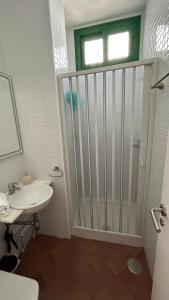 a bathroom with a shower and a sink at Brisa Marinera in El Rompido +16 photos