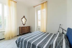 Letto o letti in una camera di 099 A due passi dal mare