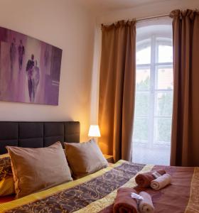 Hotel Rychta Netolice tesisinde bir odada yatak veya yataklar
