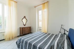 Letto o letti in una camera di 099 A due passi dal mare