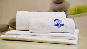a pile of towels sitting on top of a pile of towels at Zero5.Zero5 in Lignano Sabbiadoro