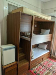 a bunk bed in a room with a bunk bedutenewayewayangering at Miami Hotel in Cairo