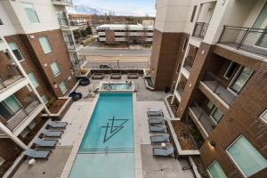 an overhead view of a swimming pool in a apartment building at Urban Oasis in the Center of SLC in Salt Lake City