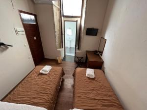 Postel nebo postele na pokoji v ubytování Rethymno House