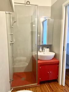 a bathroom with a glass shower and a sink at Dimora nel Palazzo Ducale in Giovinazzo