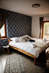 A bed or beds in a room at Sipos Borház és Vendégház
