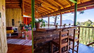 a bar in a house with a view of the mountains at Olabilir Houses in Ortaca