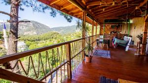 a balcony of a house with a view of a tree at Olabilir Houses in Ortaca