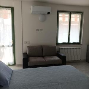 A bed or beds in a room at Fiordaliso B&B