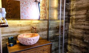a bathroom with a large bowl sink on a counter at Wind Of Alaçatı Adult Only 13 in Çeşme +18 photos