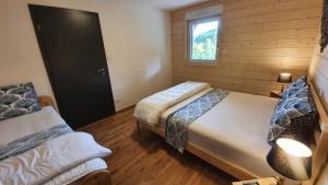 Łóżko lub łóżka w pokoju w obiekcie CHALET LES PRIMEVÈRES 4 Étoiles