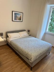 A bed or beds in a room at Rhome Holiday Fornaci