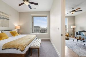 a bedroom with a large bed and a window at King BD - City View - Downtown Walking Paradise in Salt Lake City
