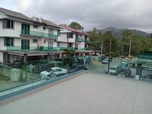 a view from the roof of a building with a parking lot at EMERALD VILLA HOMESTAY DUNGUN in Batu Lima