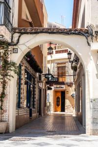 an archway in a street in a town at Hostel Welcome Benidorm in Benidorm