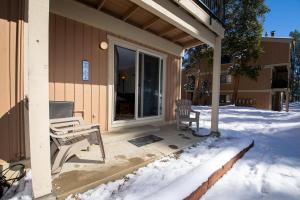 a porch of a house in the snow at Beaver Village Unit #0211 in Winter Park