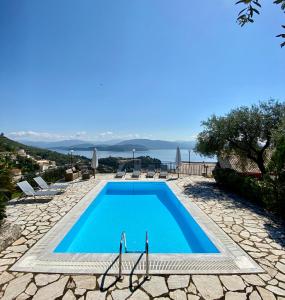 a villa with a pool and a view at Villa Chrysoula in Kalami