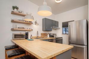 a kitchen with a wooden counter top and a refrigerator at Beaver Village Unit #0332 in Winter Park +23 photos