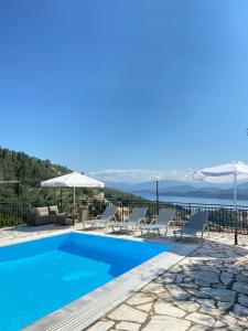 a villa with a pool and a view at Villa Chrysoula in Kalami