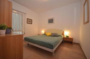 A bed or beds in a room at Villaggio Laura