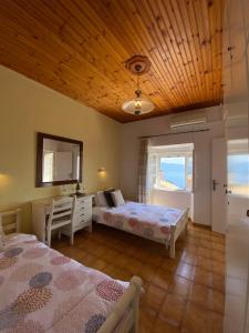 Postel nebo postele na pokoji v ubytování Villa Chrysoula + 29 fotografií